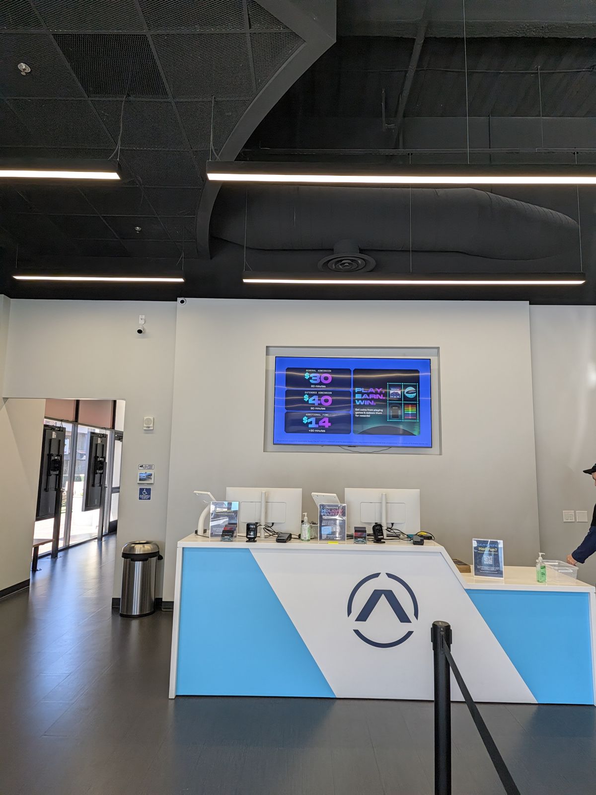 Check-in desk inside the Activate Games Tustin lobby