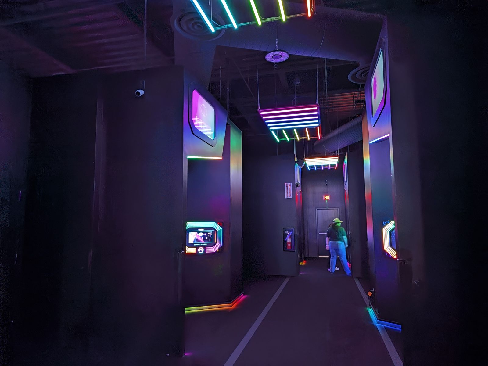 Row of game room doors with LED lighting at Activate Games Tustin