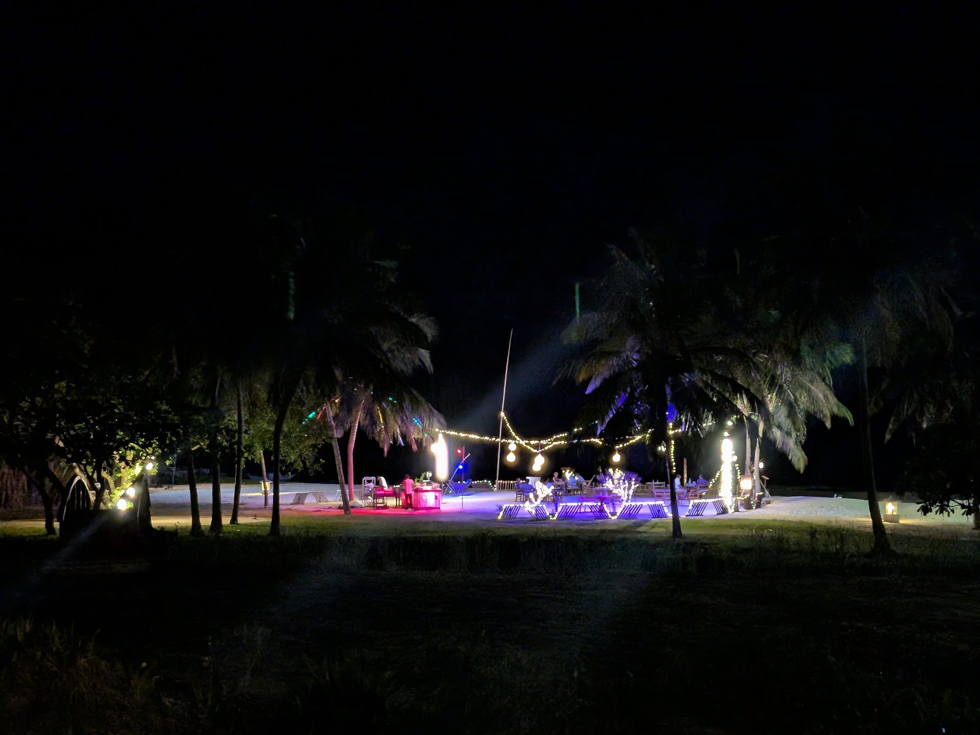 Beach dinner setup with lights at night at Anantaya Pasikudah