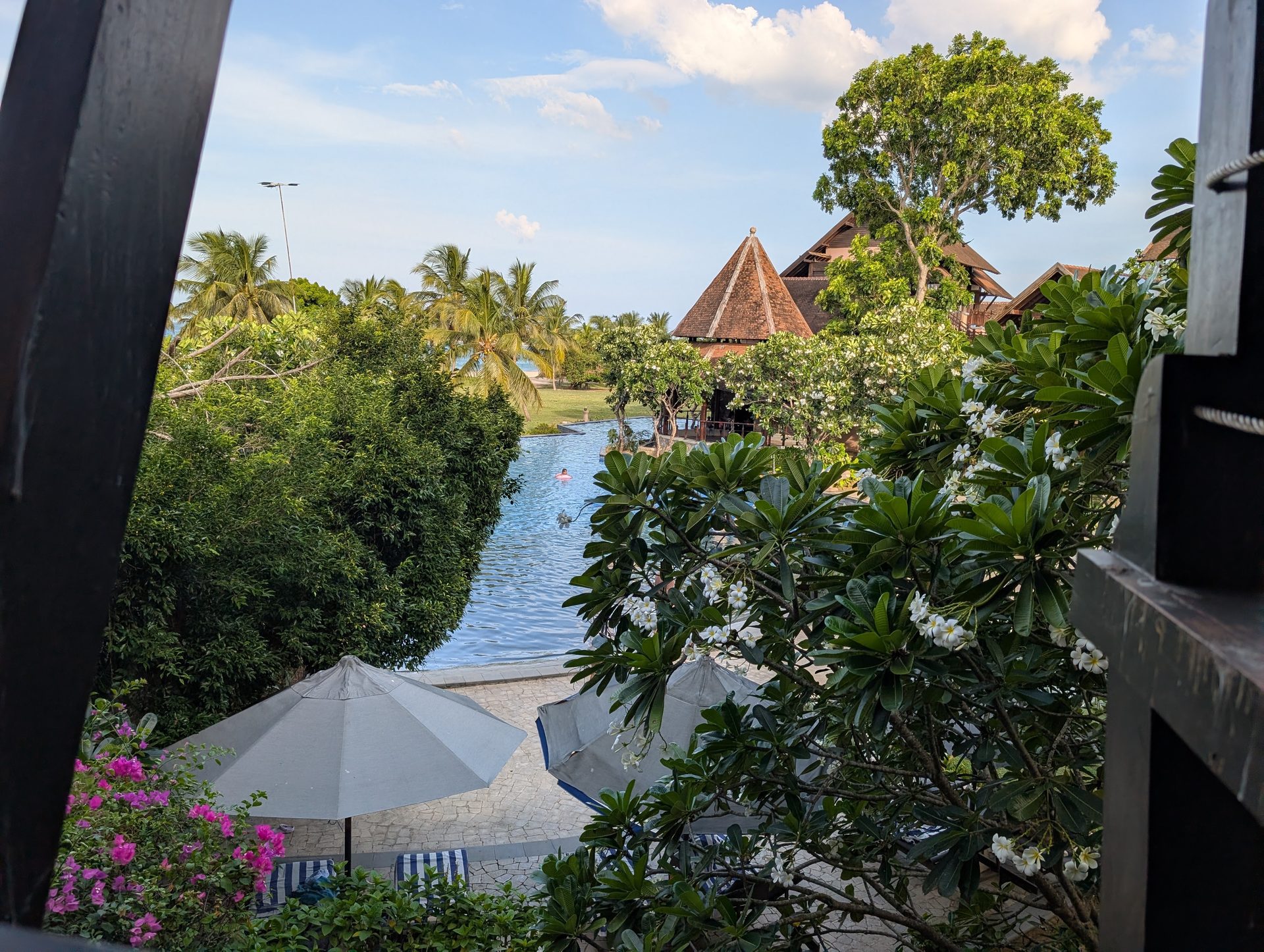 View of the gardens and thatched roofs from a room at Anantaya Pasikudah