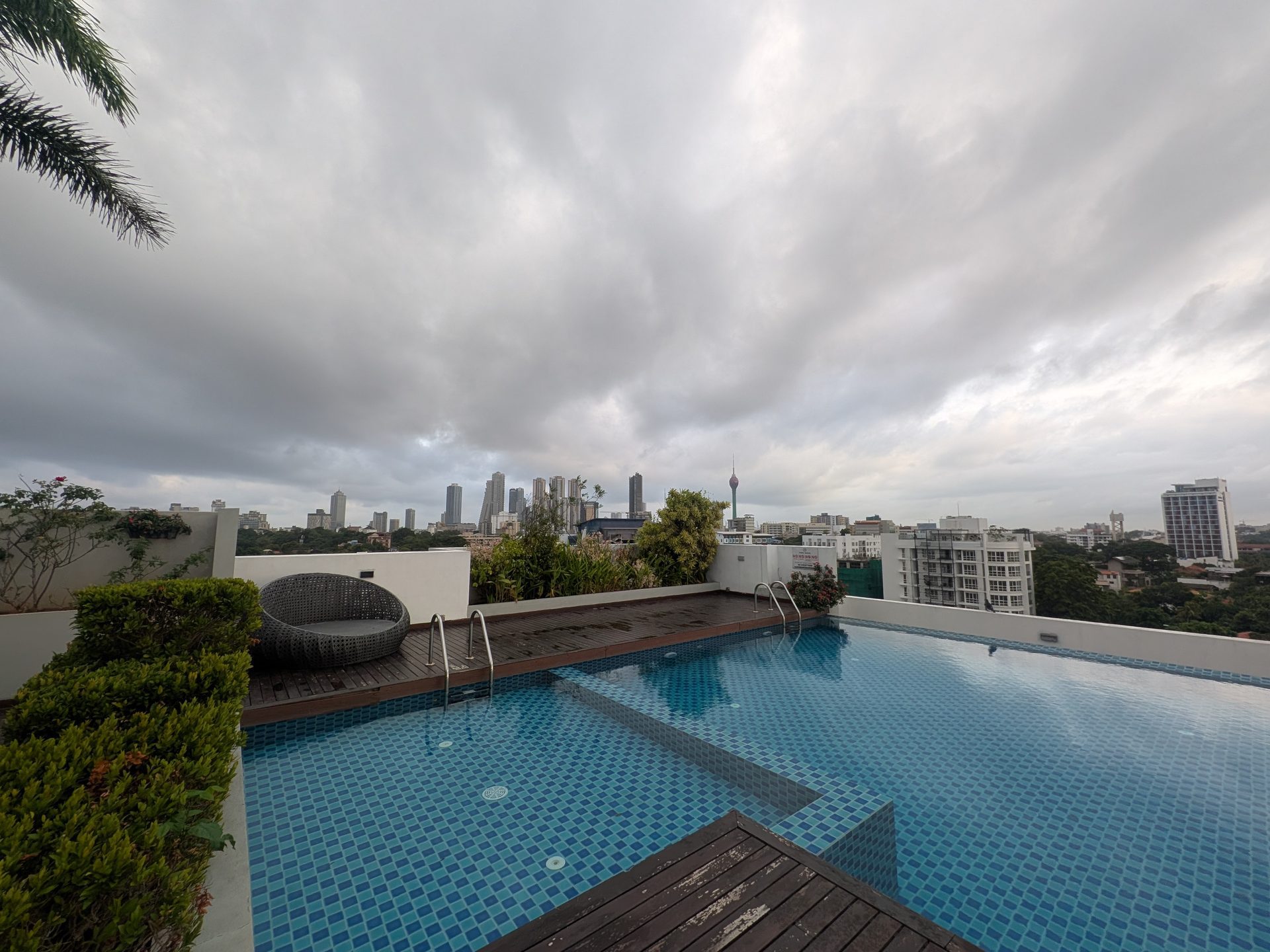 Rooftop pool at Capitol Elite with the Colombo skyline