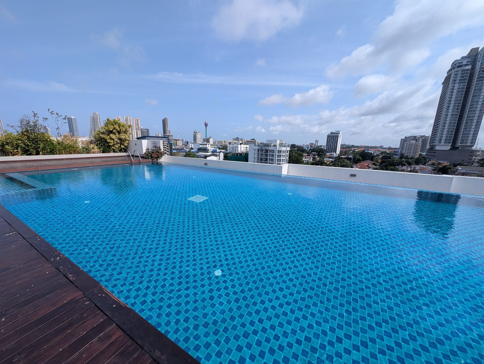 Blue rooftop pool at Capitol Elite on a sunny morning