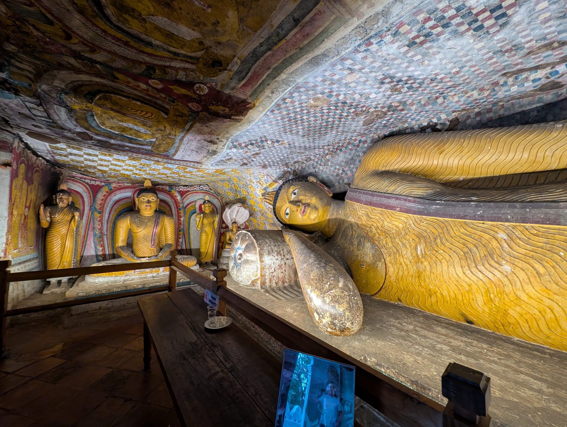 Reclining Buddha with painted walls and ceiling at Dambulla