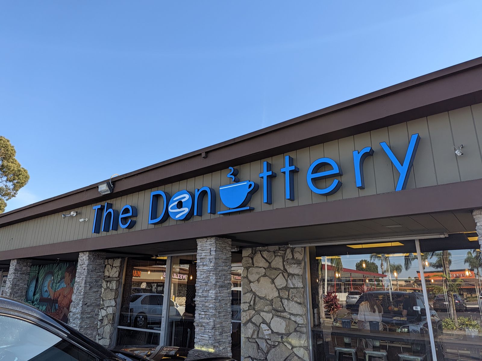 The Donuttery sign and stone pillars at its Huntington Beach shop