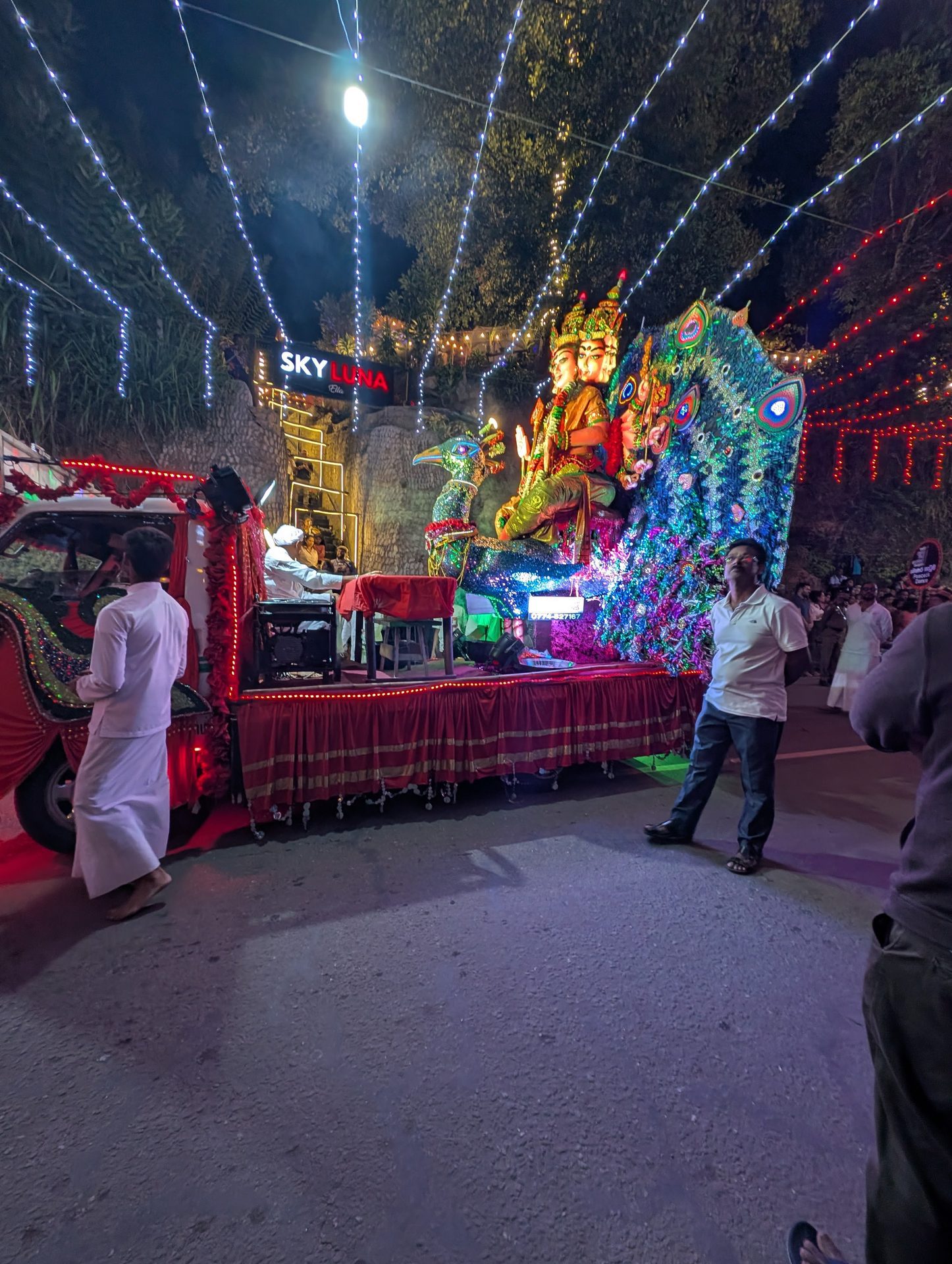 Lit-up religious float at the end of the Ella perahera