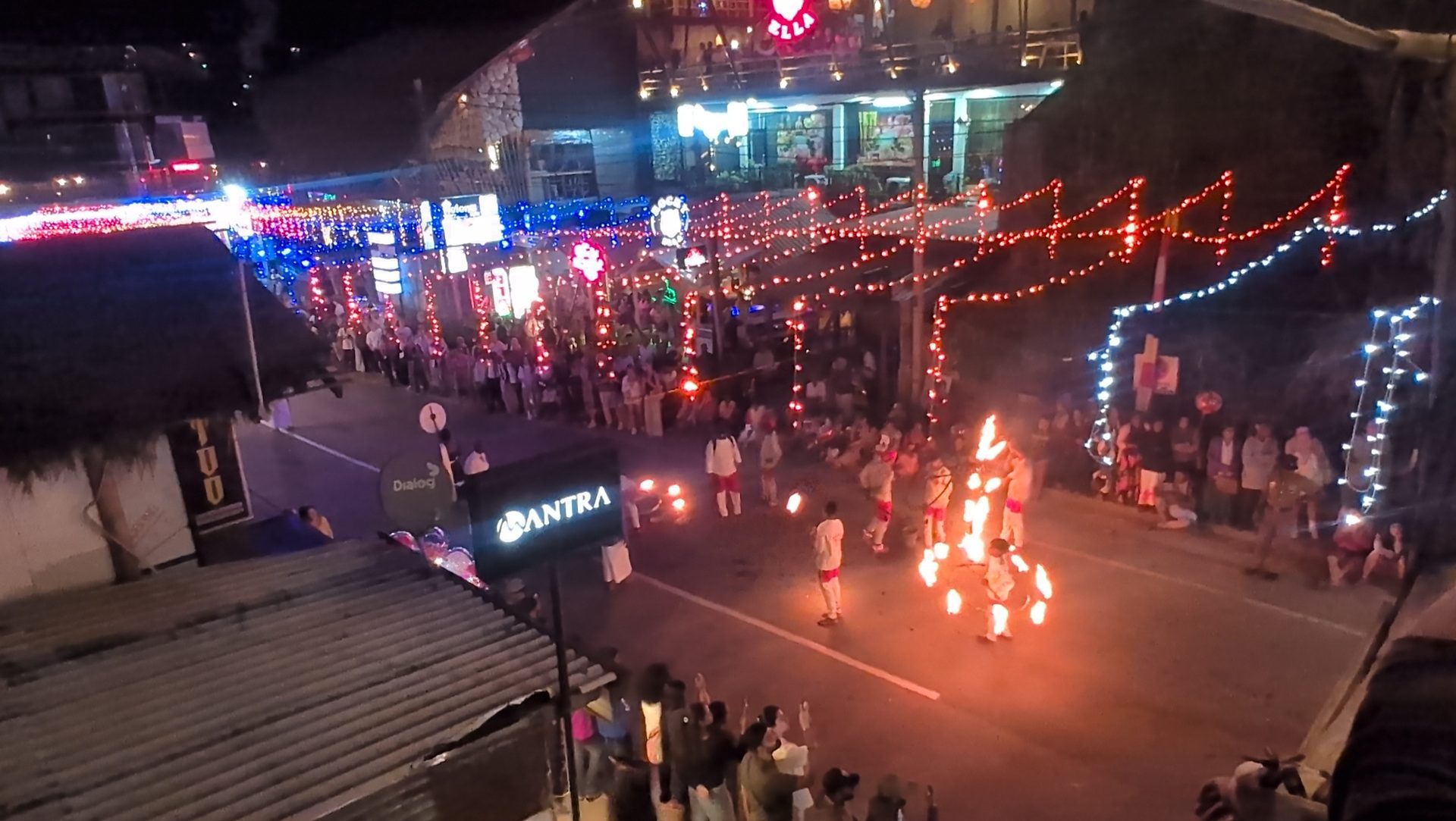 Fire dancers moving down the main street in Ella during a perahera