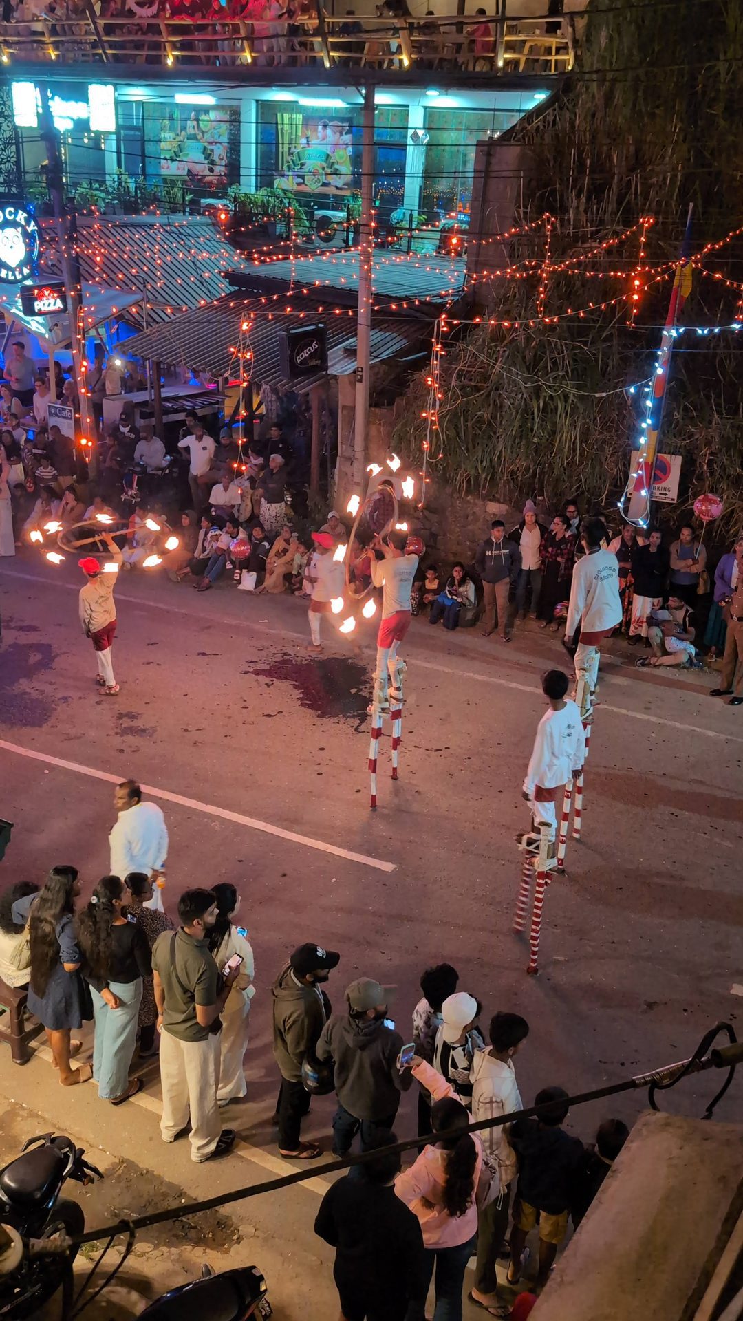 Stilt walkers in the Ella perahera procession