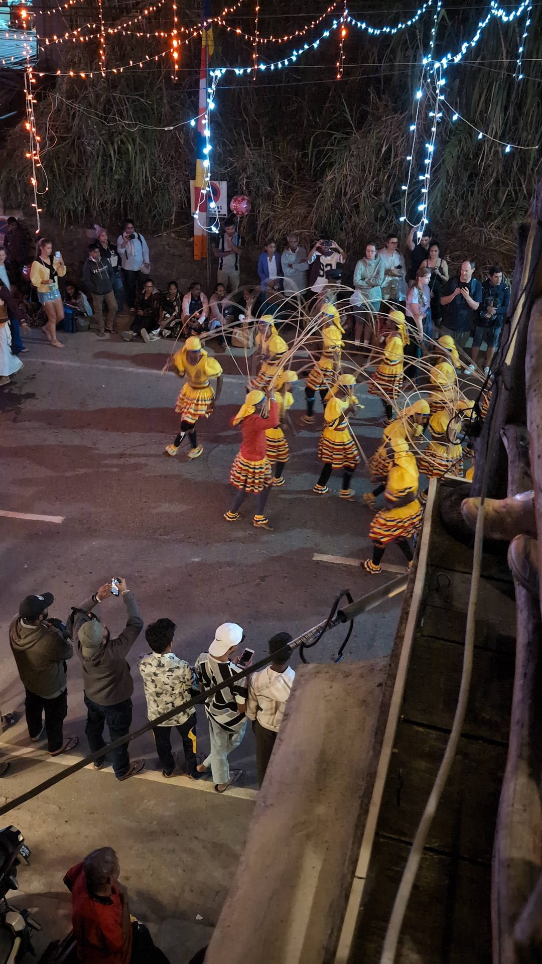 Dancers in yellow costumes at the Ella perahera