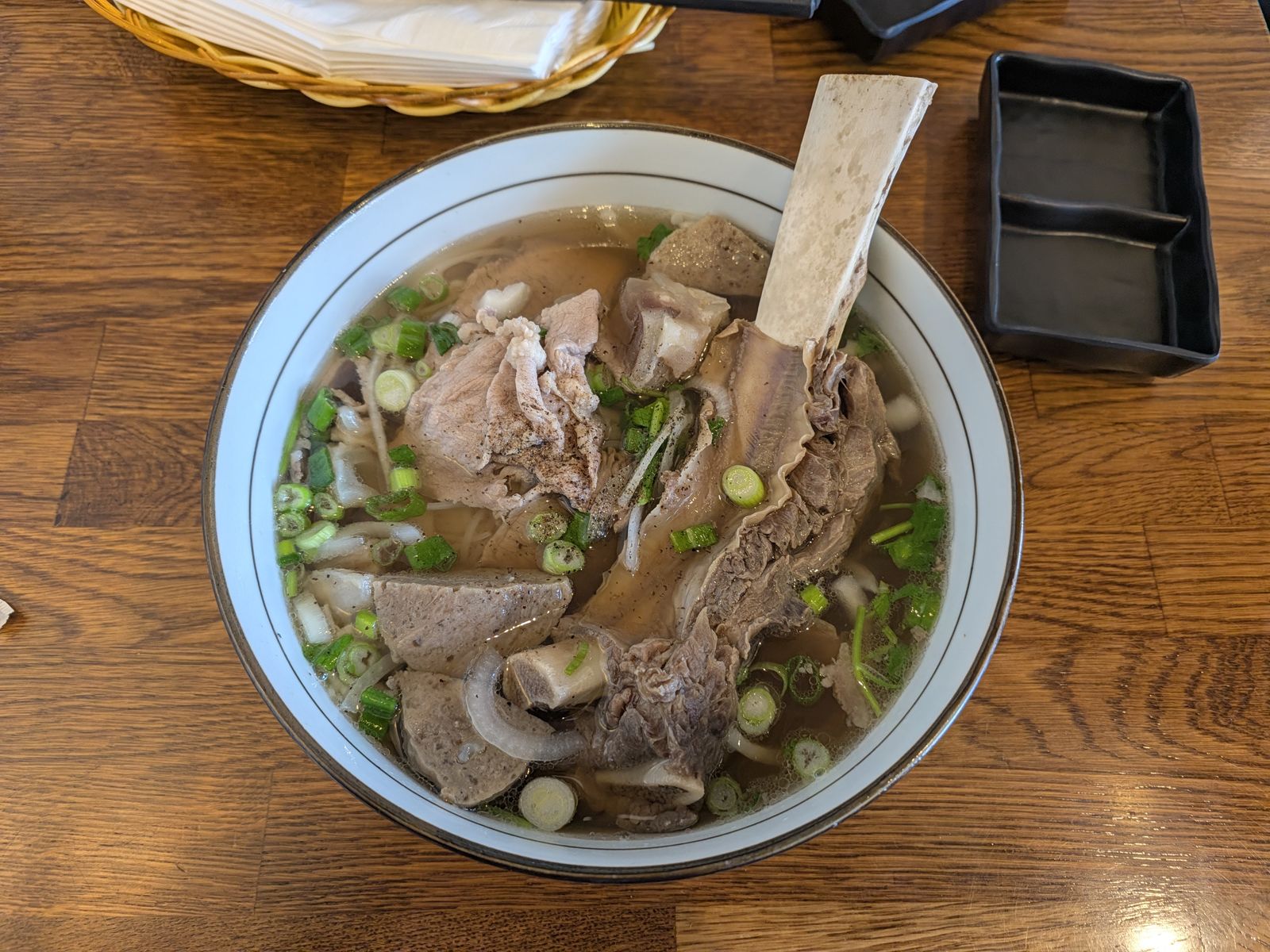 Fire Pho Fire Bowl with brisket, rare steak, tendon, beef balls and beef rib