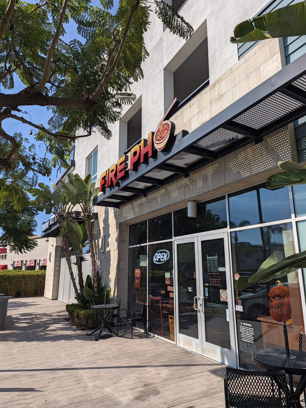 Fire Pho Huntington Beach entrance with outdoor tables