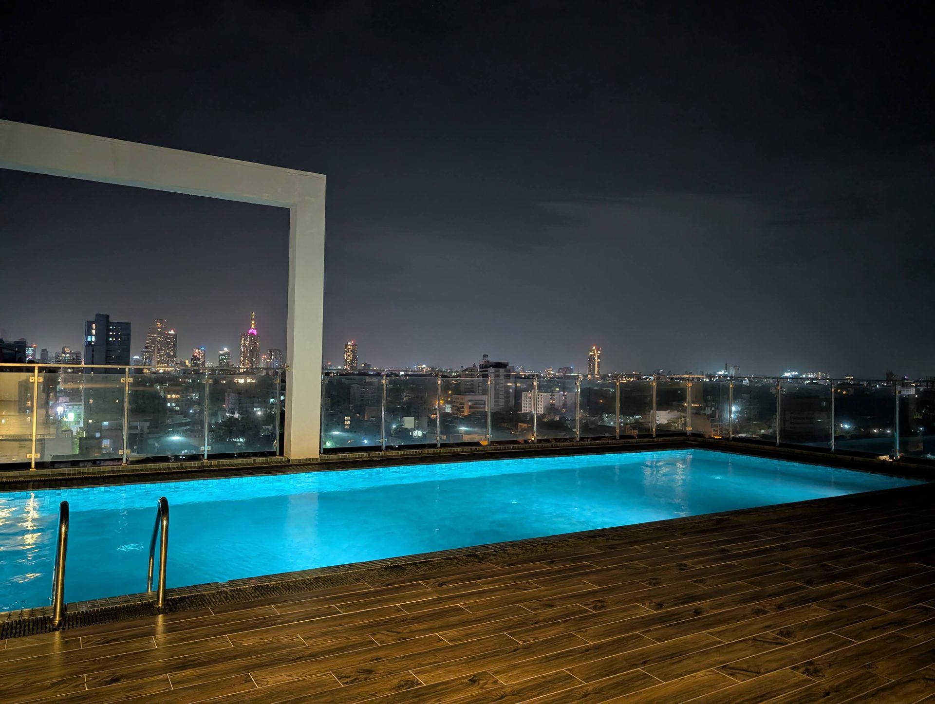 Rooftop pool at The Flemington lit up at night