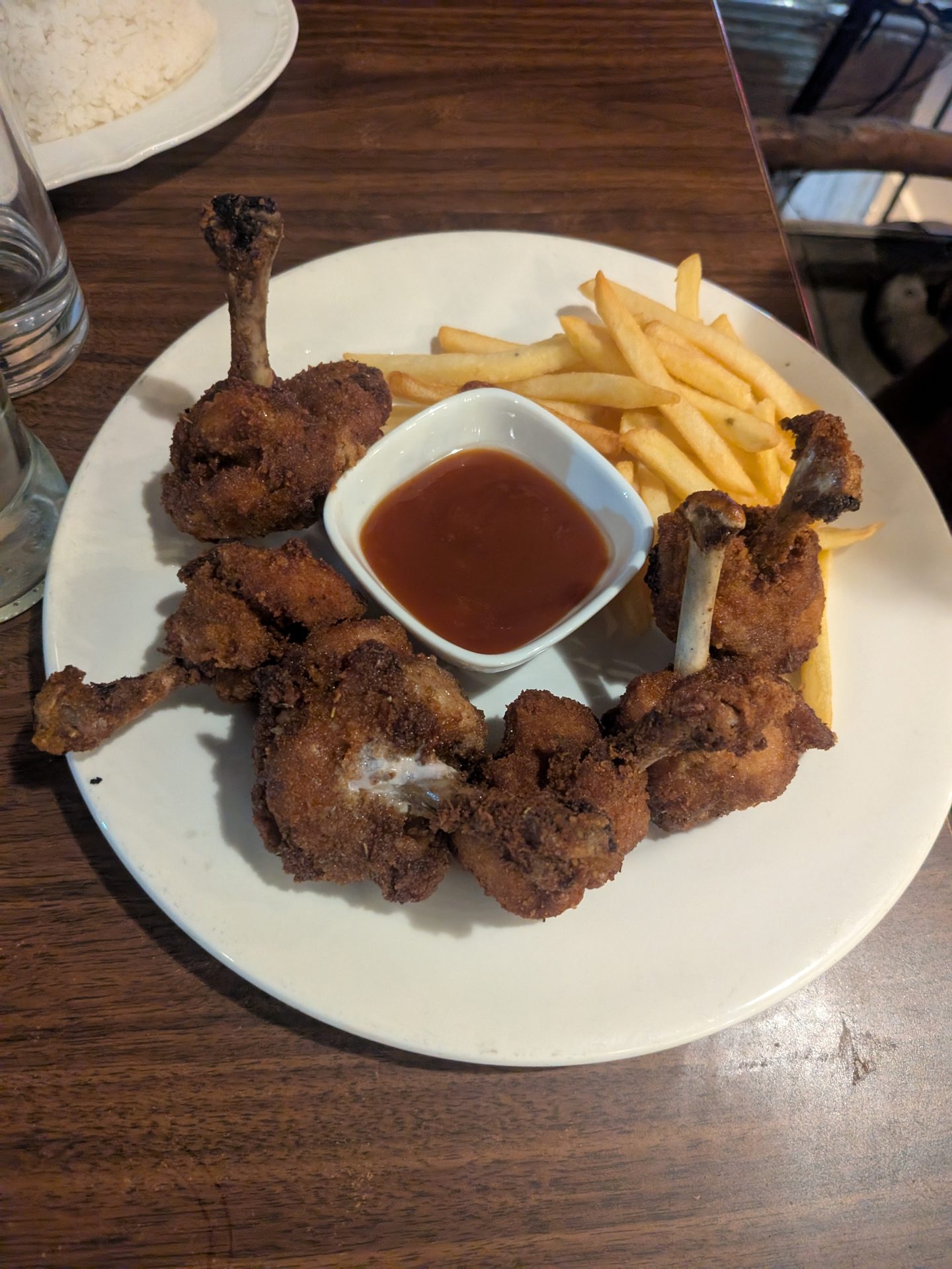 Fried chicken and fries at a restaurant in Ella
