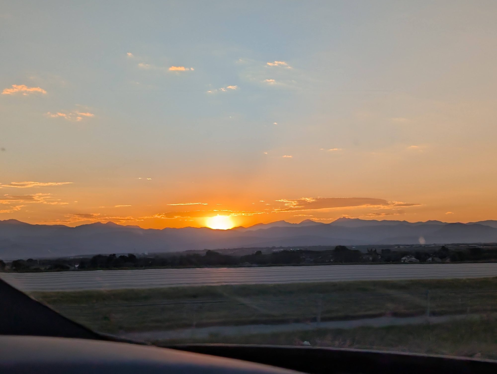 Sunset over the Front Range mountains seen from the drive between Denver airport and Estes Park