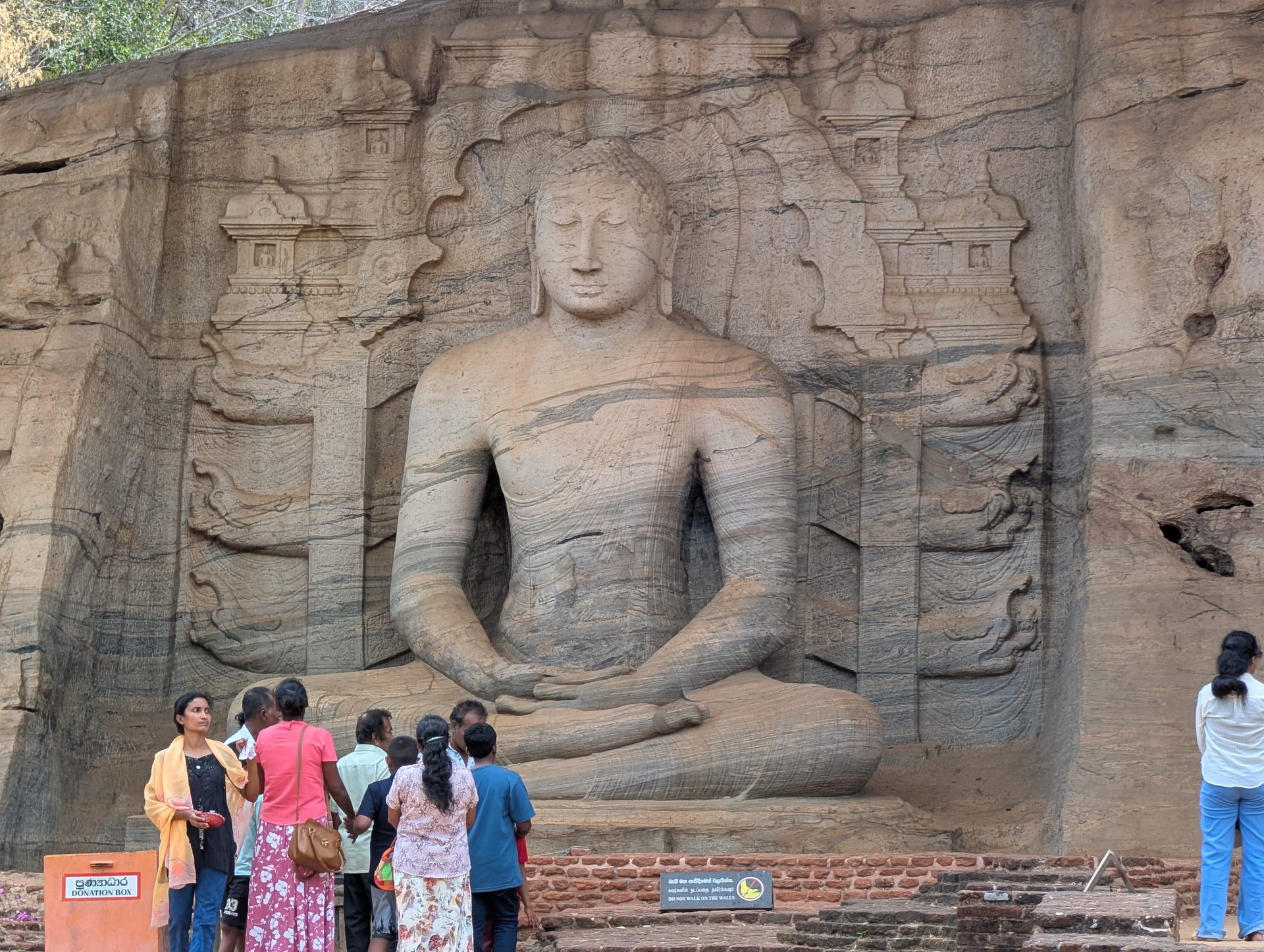 Seated Buddha carved into rock at Gal Vihara