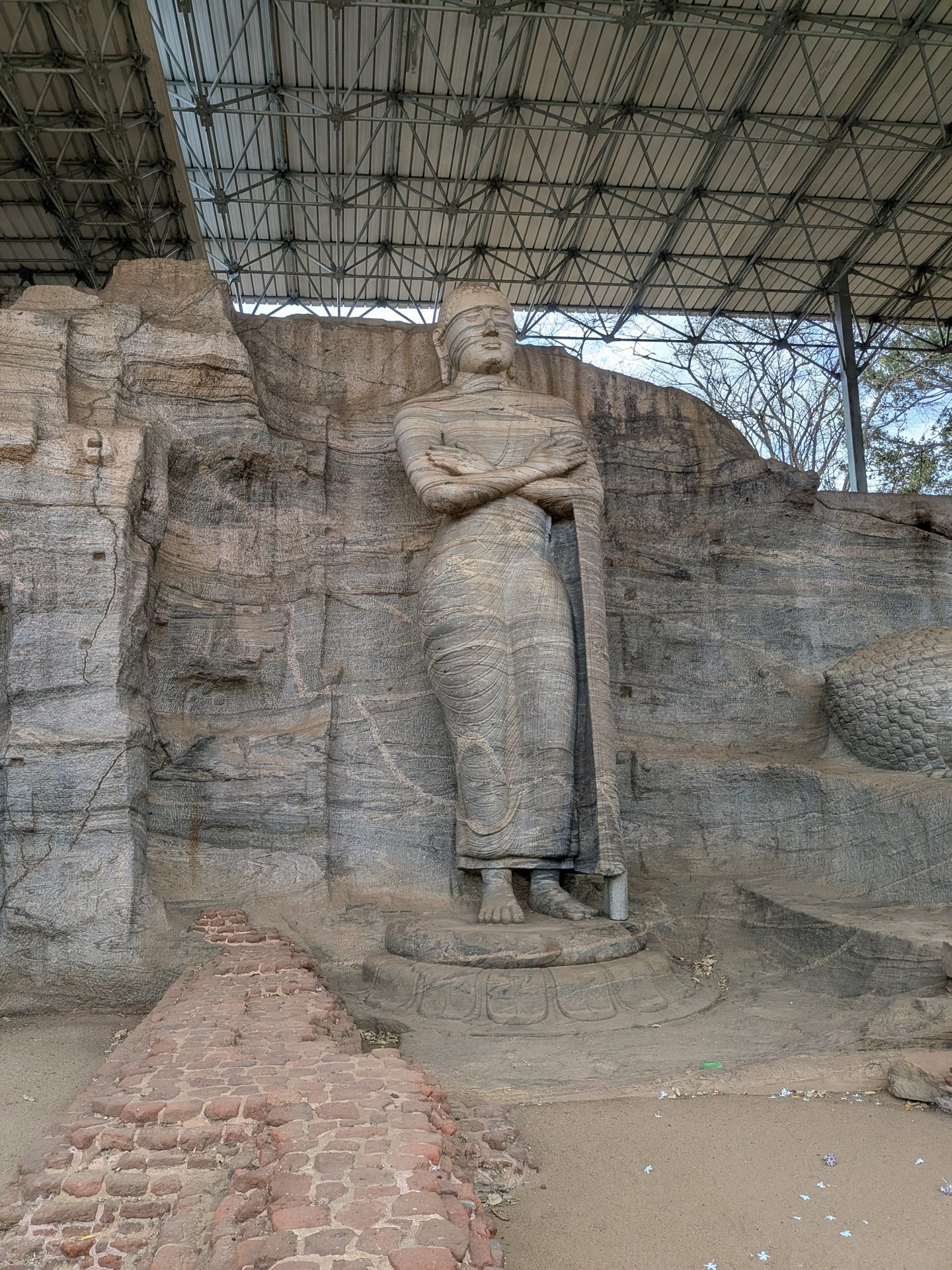 Standing figure with crossed arms at Gal Vihara
