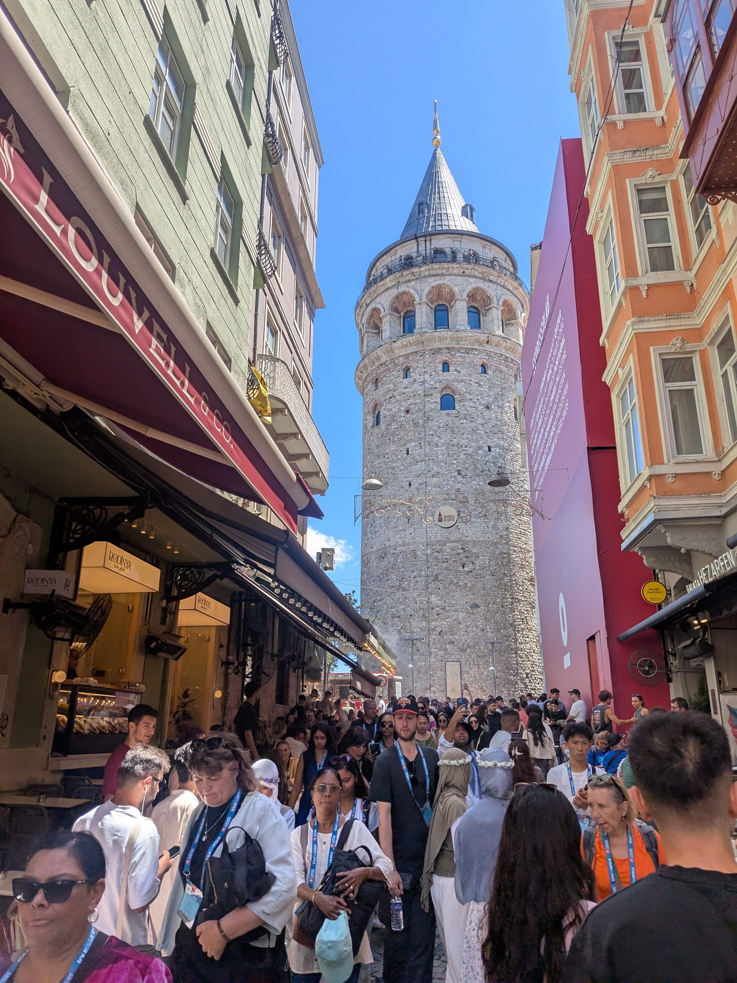 Galata Tower seen from a busy shopping street in Galata