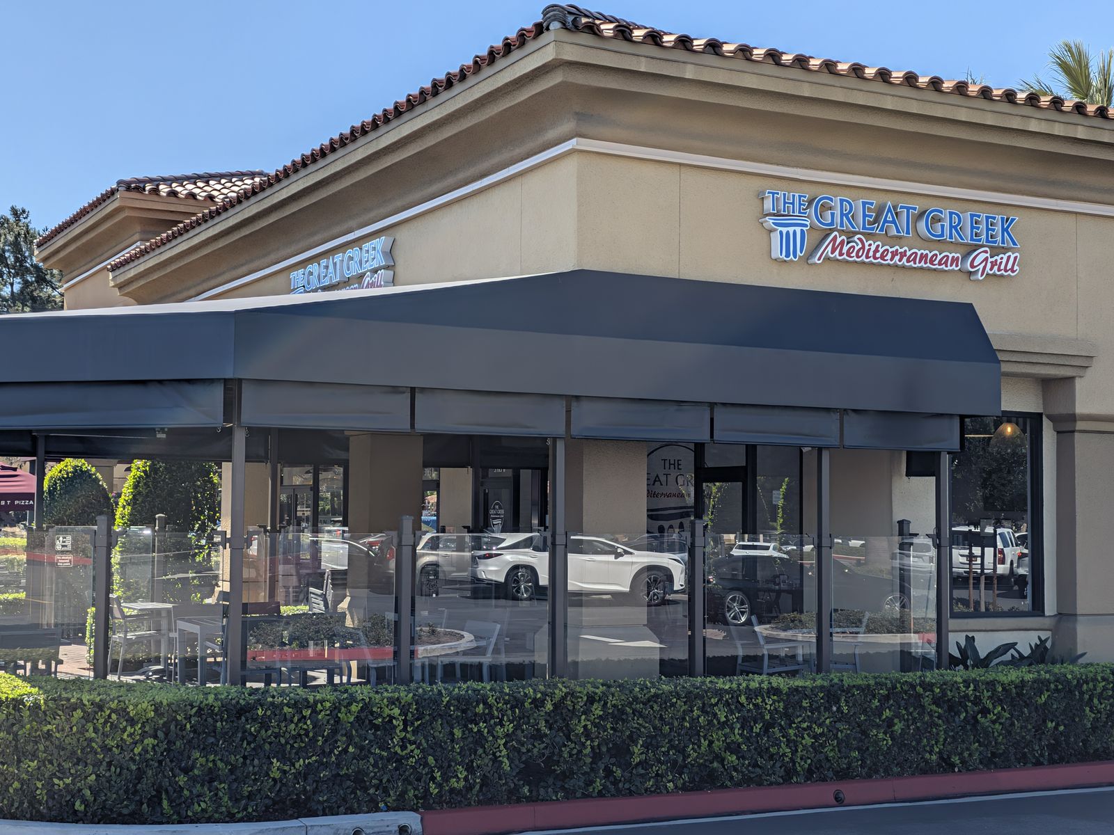 Covered outdoor patio at The Great Greek Mediterranean Grill in Irvine