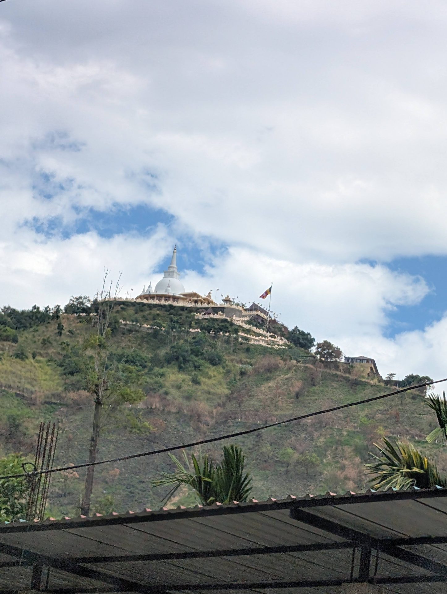 White hilltop Buddhist temple in Sri Lanka's hill country