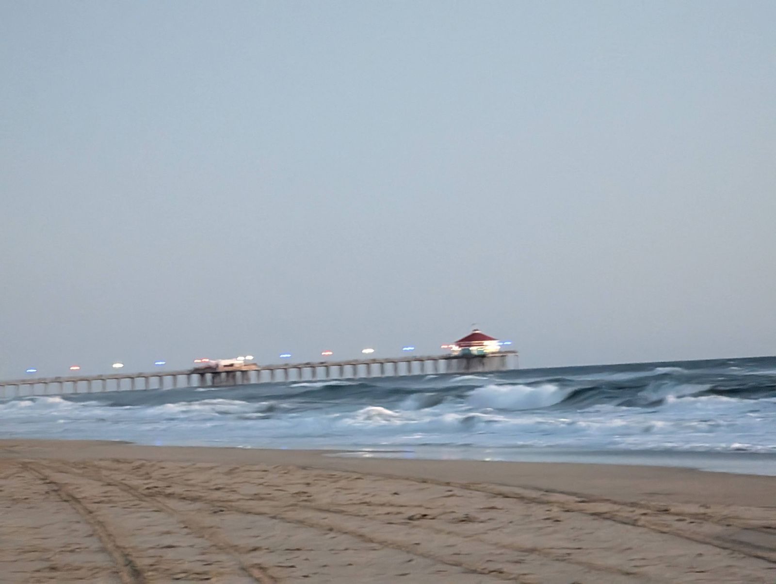 Huntington Beach Pier lit up at dusk