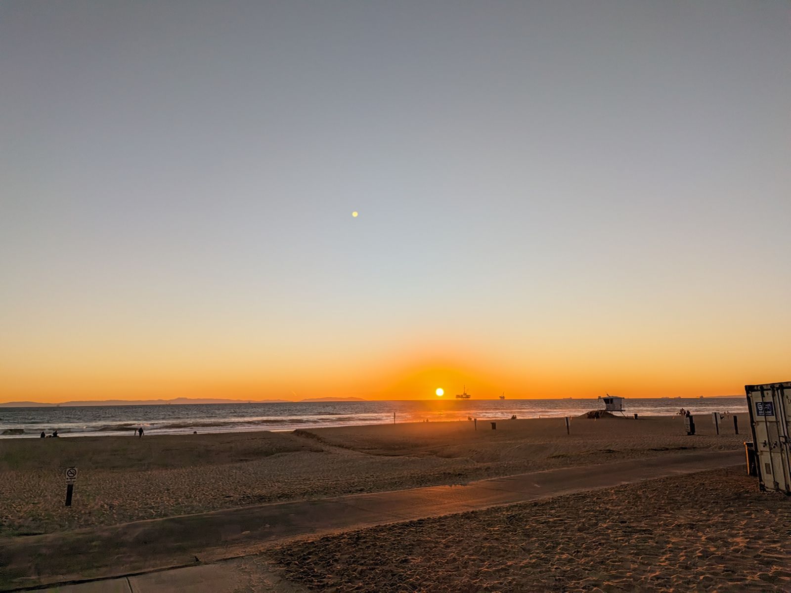 Sunset over Huntington City Beach with a lifeguard tower