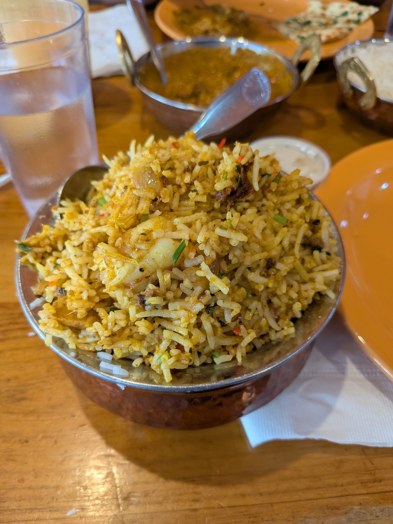 Biryani served in a copper bowl at Indian Bites Estes Park