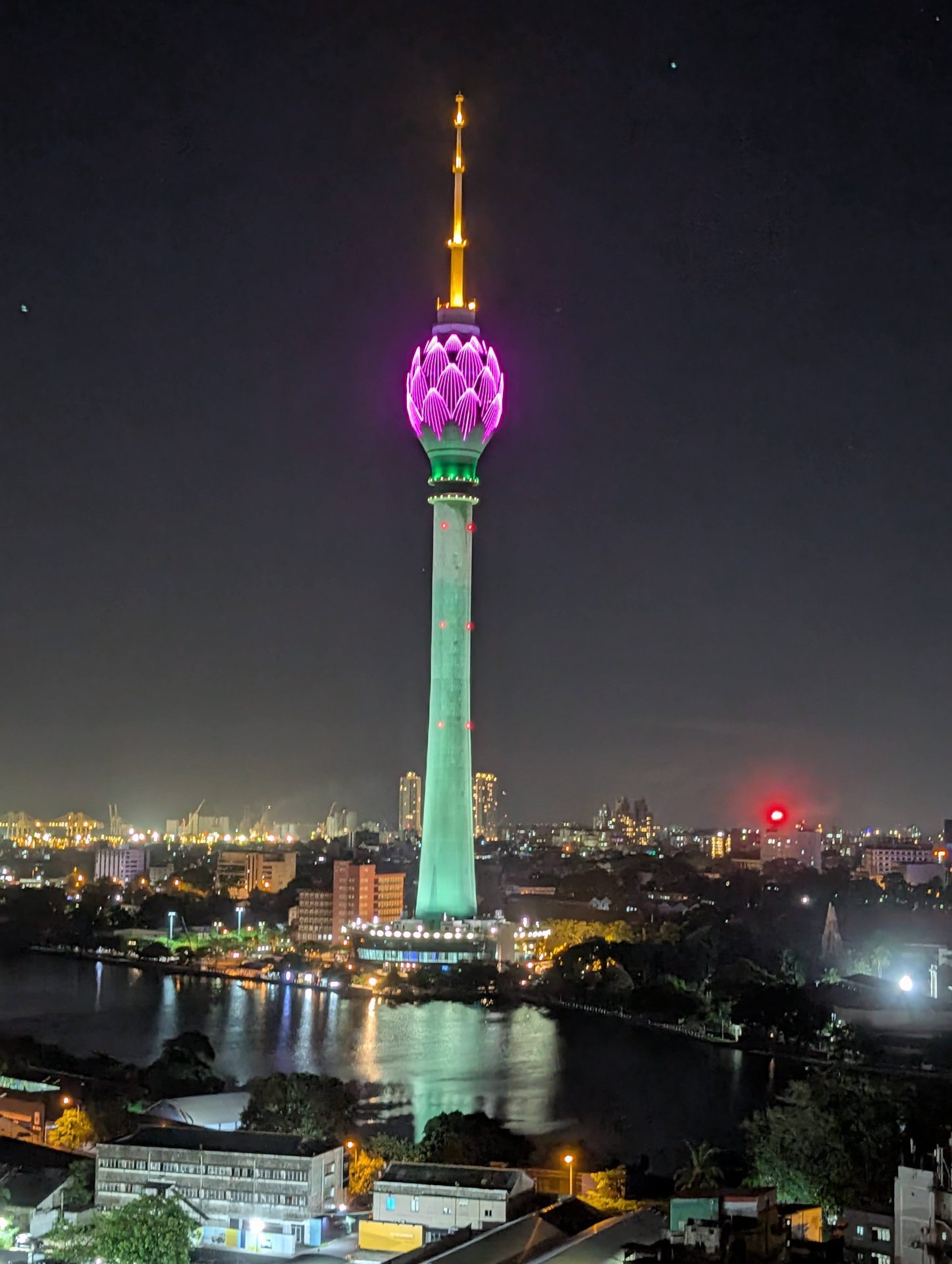 Lotus Tower lit purple at night in Colombo