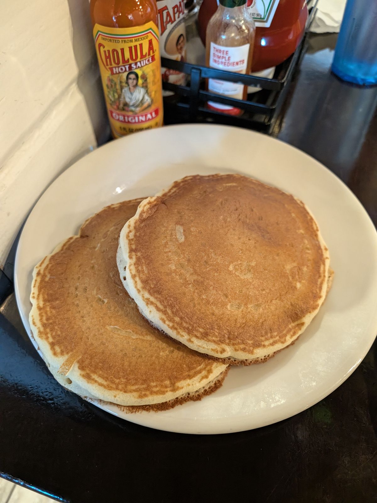 Stack of buttermilk pancakes served with the omelette