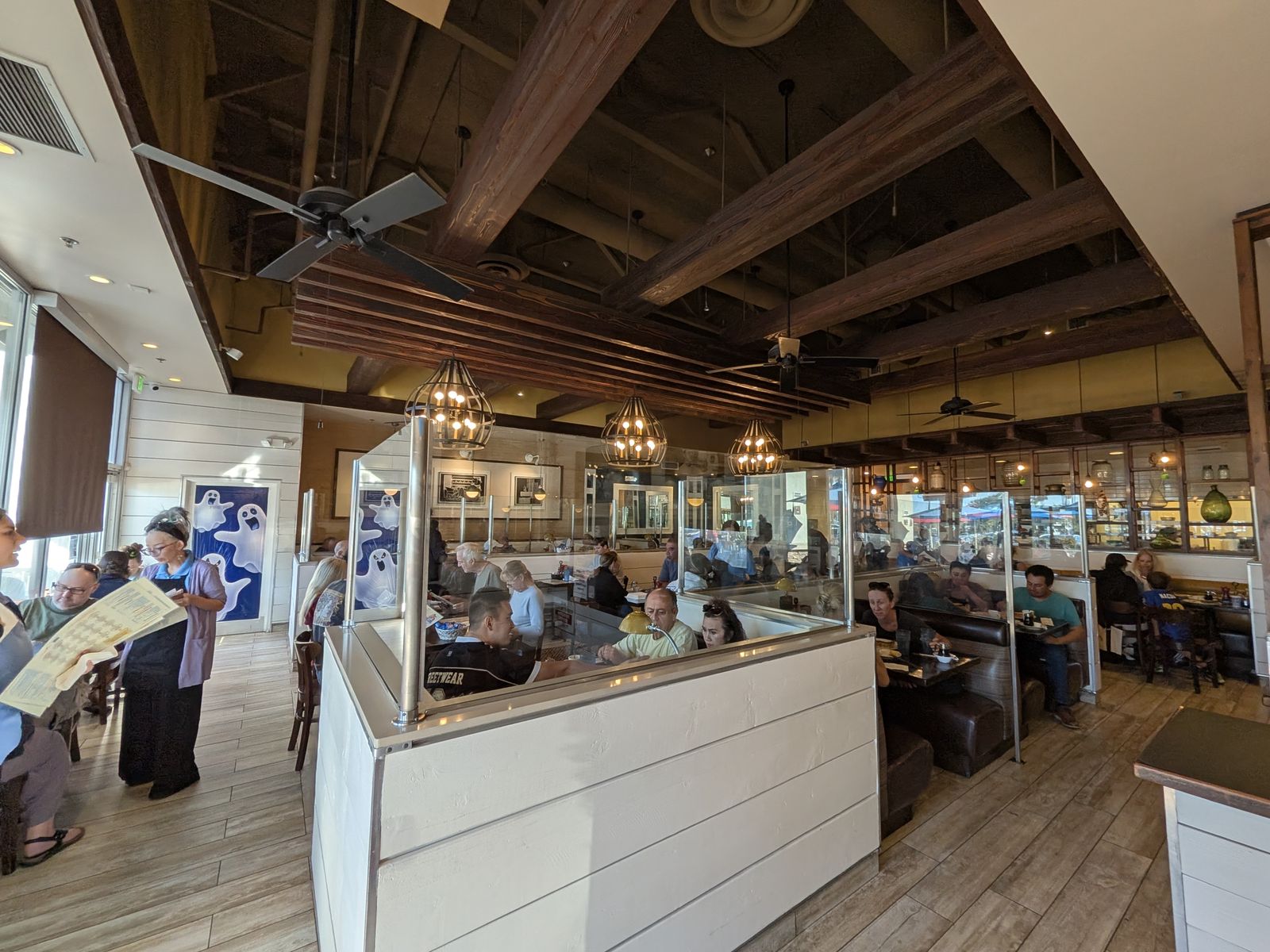 Diners and servers inside The Original Pancake House in Huntington Beach
