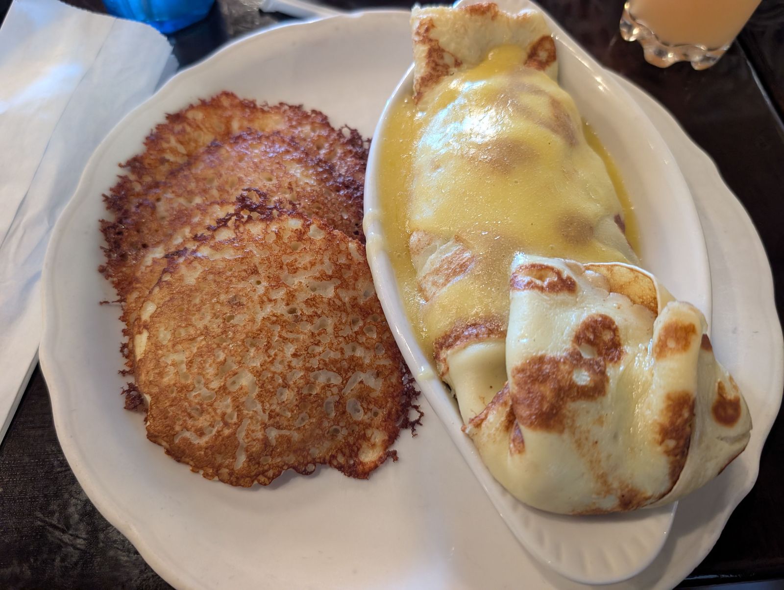 Spinach crepe with hollandaise served with potato pancakes at The Original Pancake House