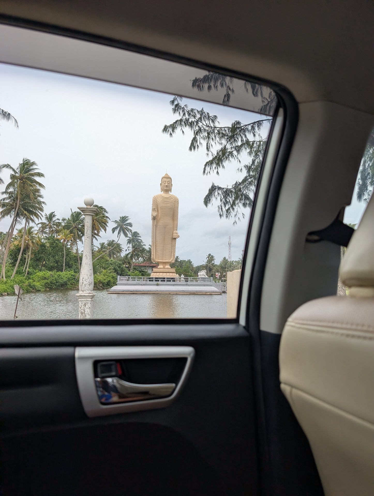 Peraliya tsunami memorial Buddha statue seen from the car on Galle Road