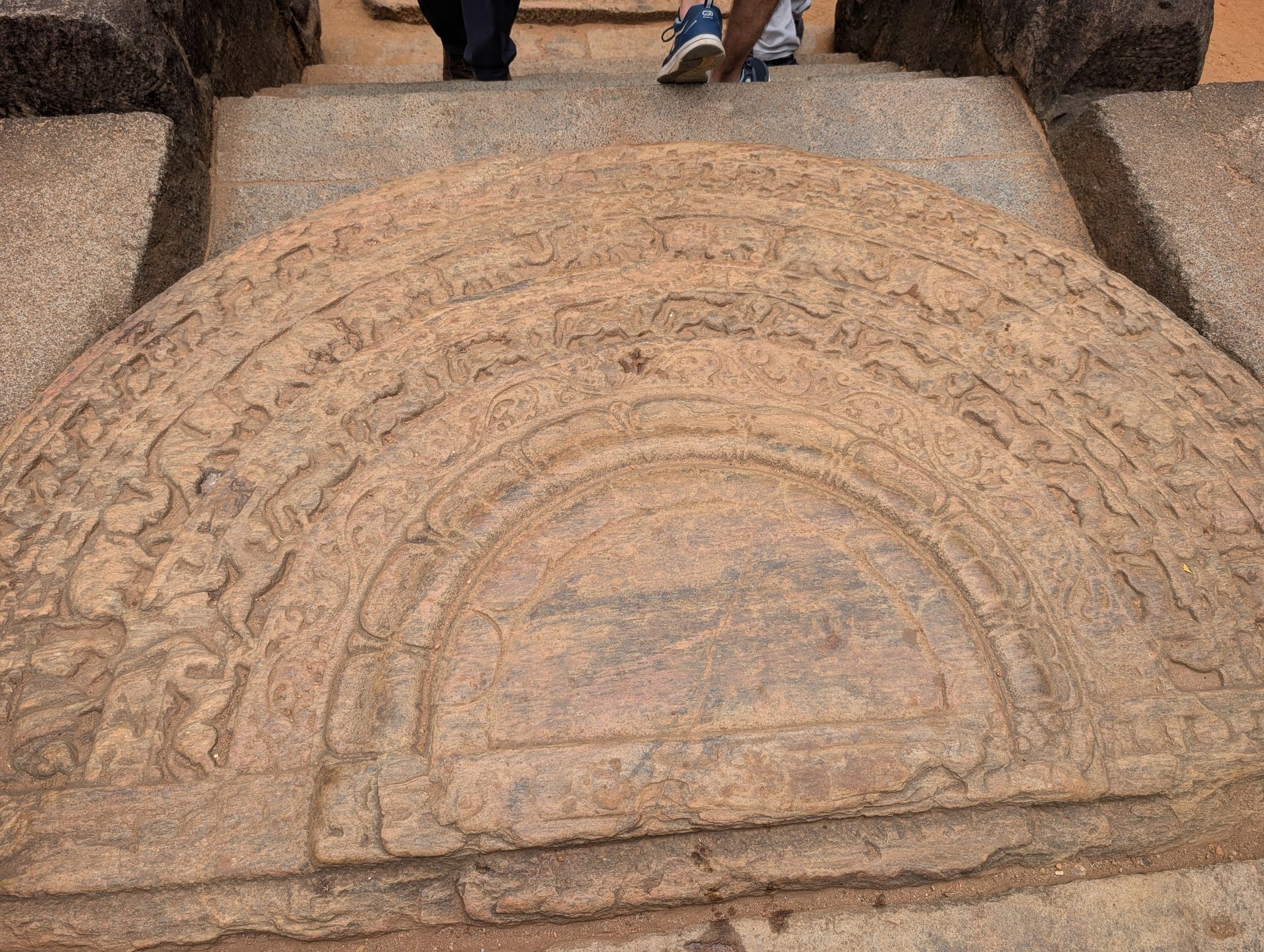 Carved moonstone at the entrance of a Polonnaruwa building