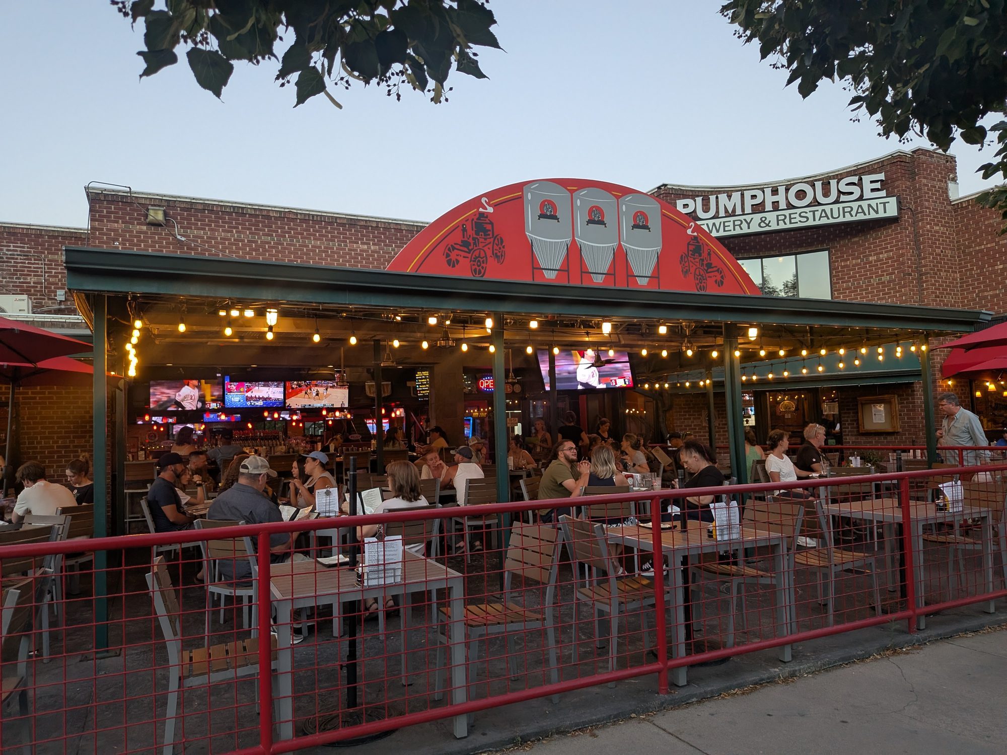 Pumphouse Brewery and Restaurant patio with string lights on Main Street in Longmont