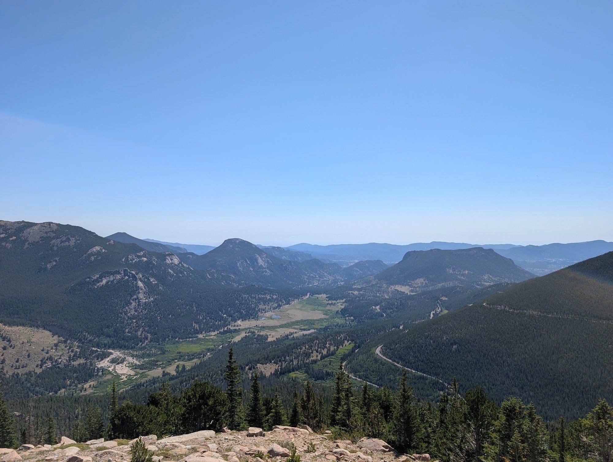 Rainbow Curve Overlook view of a winding valley and mountains in Rocky Mountain National Park
