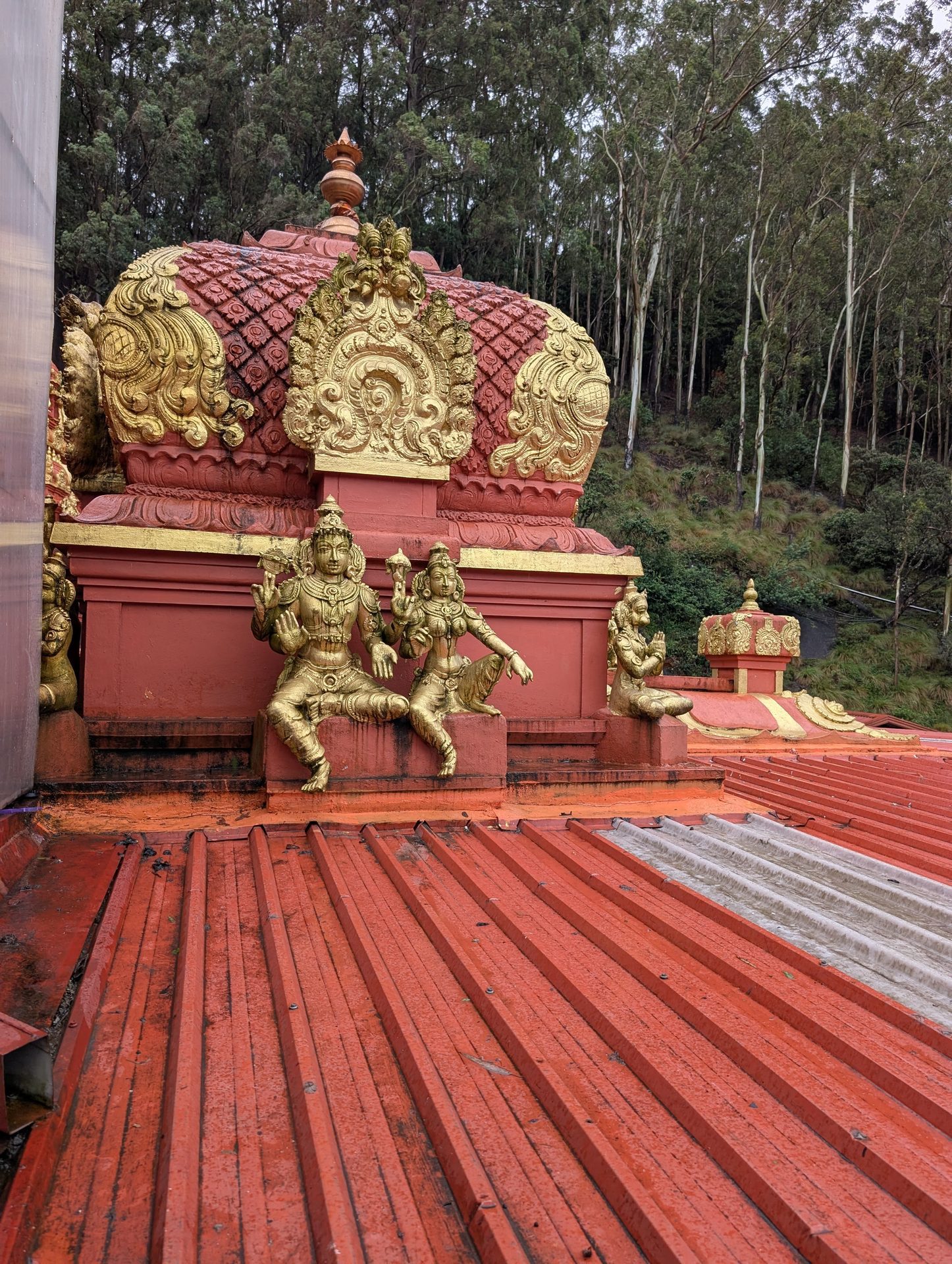 Ornate red and gold roof at the Seetha Amman Temple