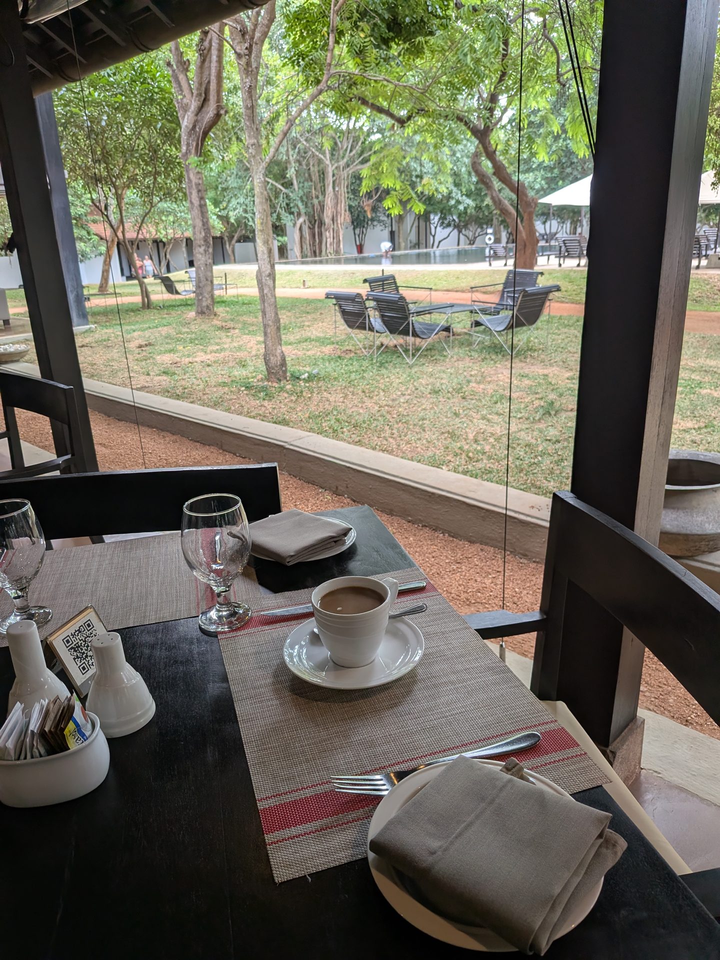 Breakfast table overlooking the garden at Sigiriya Jungles