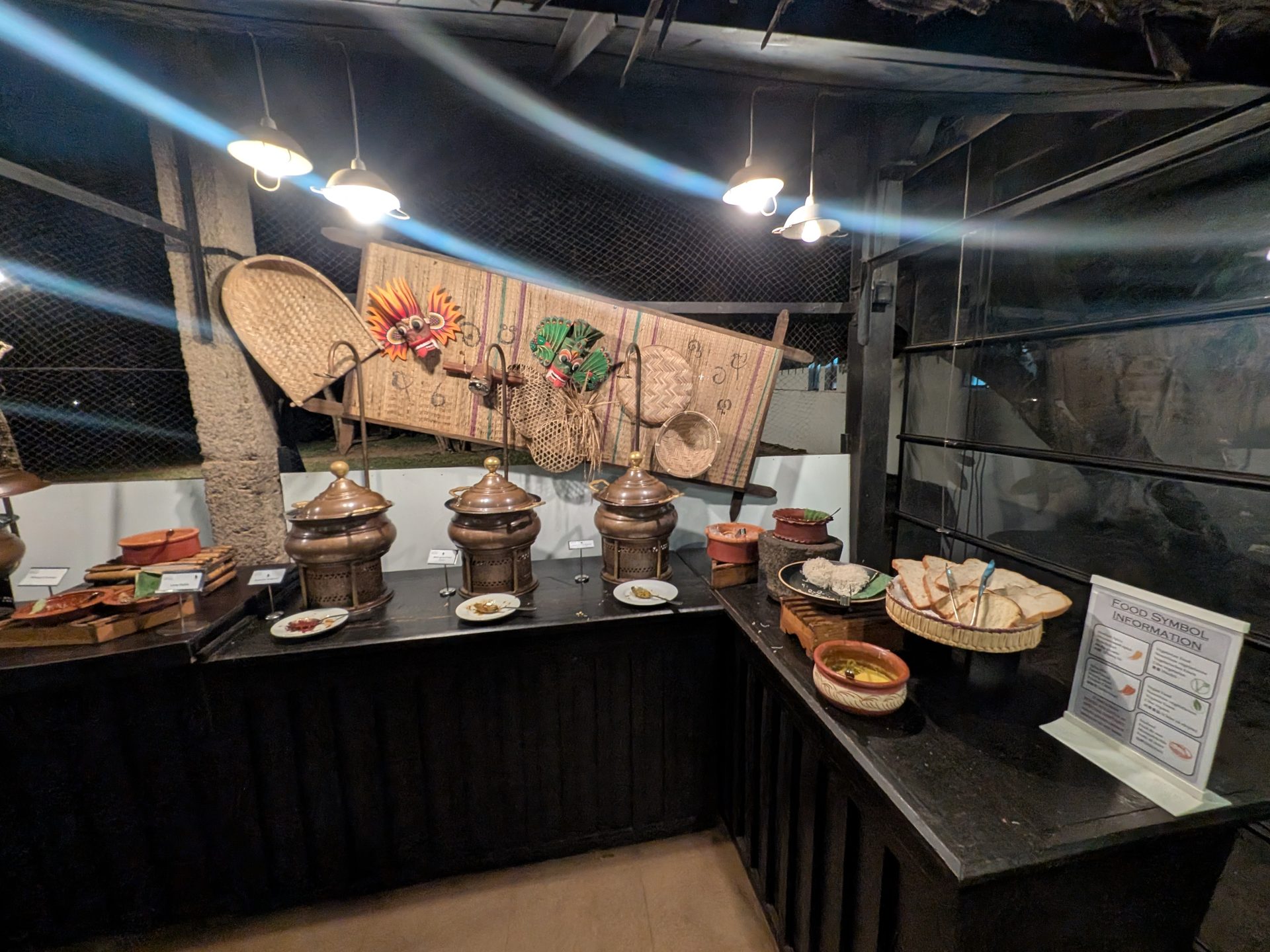 Buffet station with traditional decor at Sigiriya Jungles