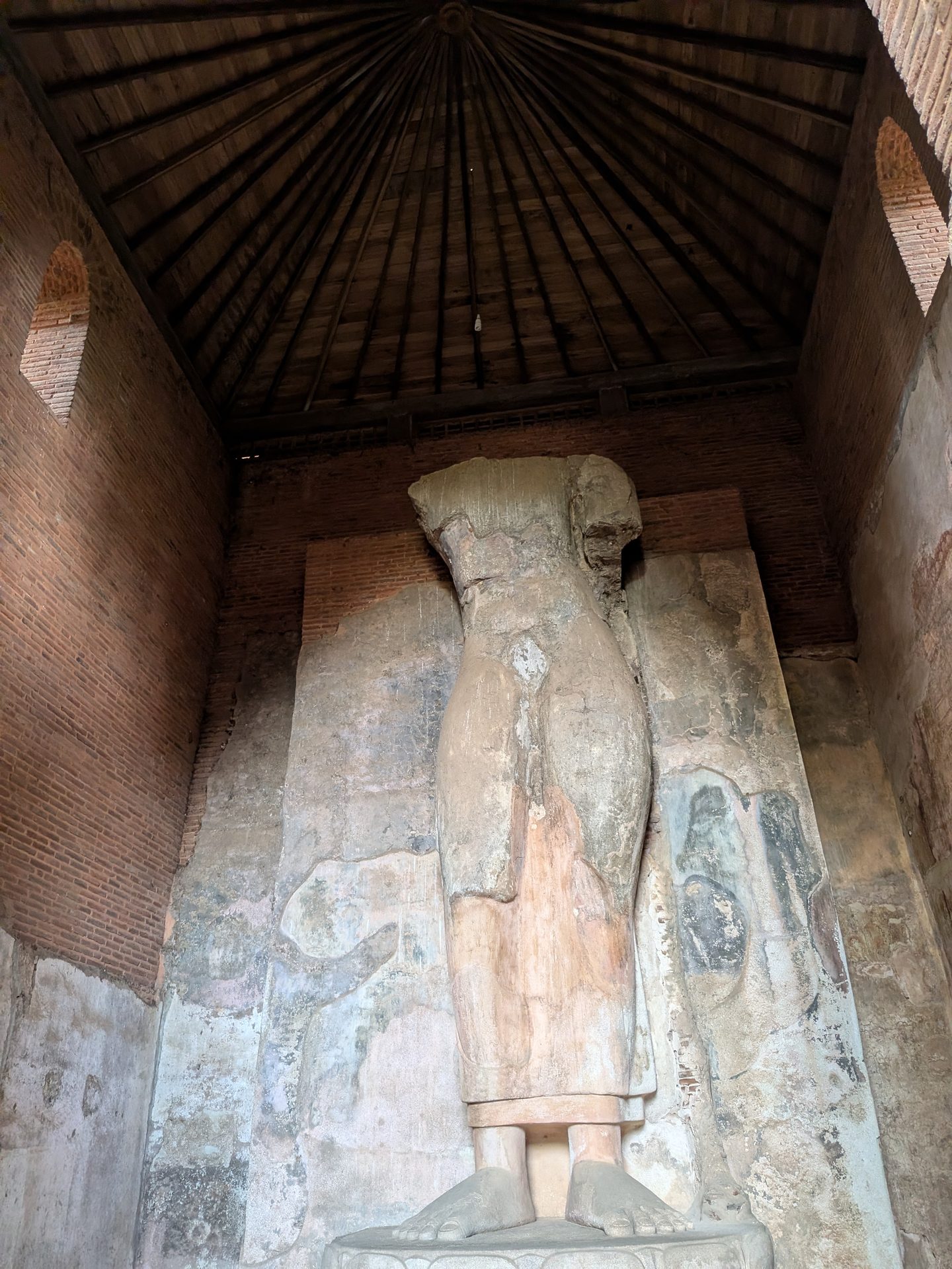 Headless standing Buddha inside Thivanka Image House
