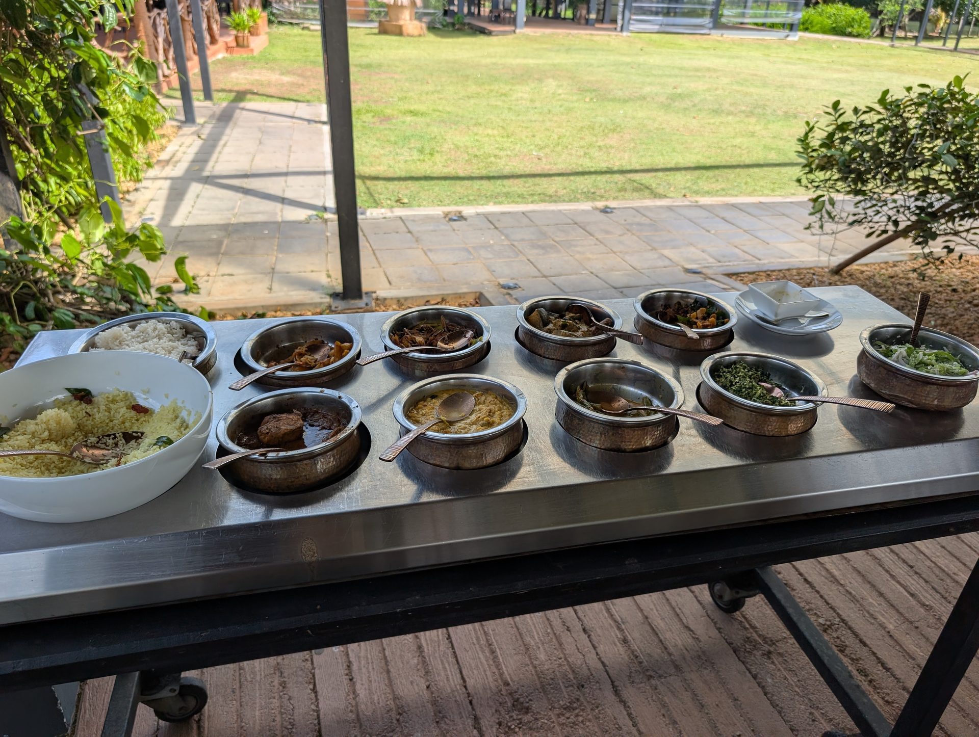 Rice and curry dishes served to the table at Thuna Paha