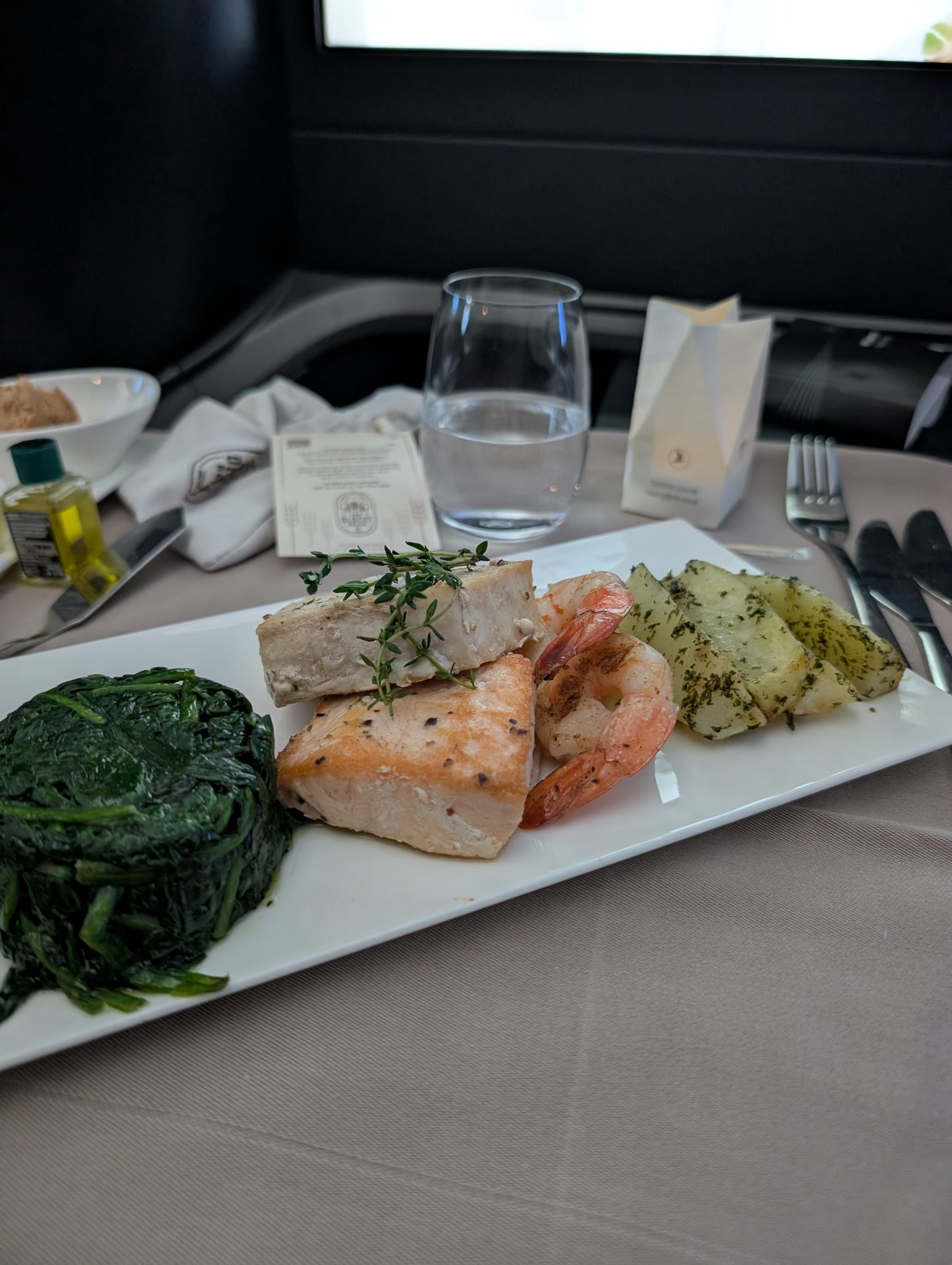 Seafood main course with spinach in Turkish Airlines business class