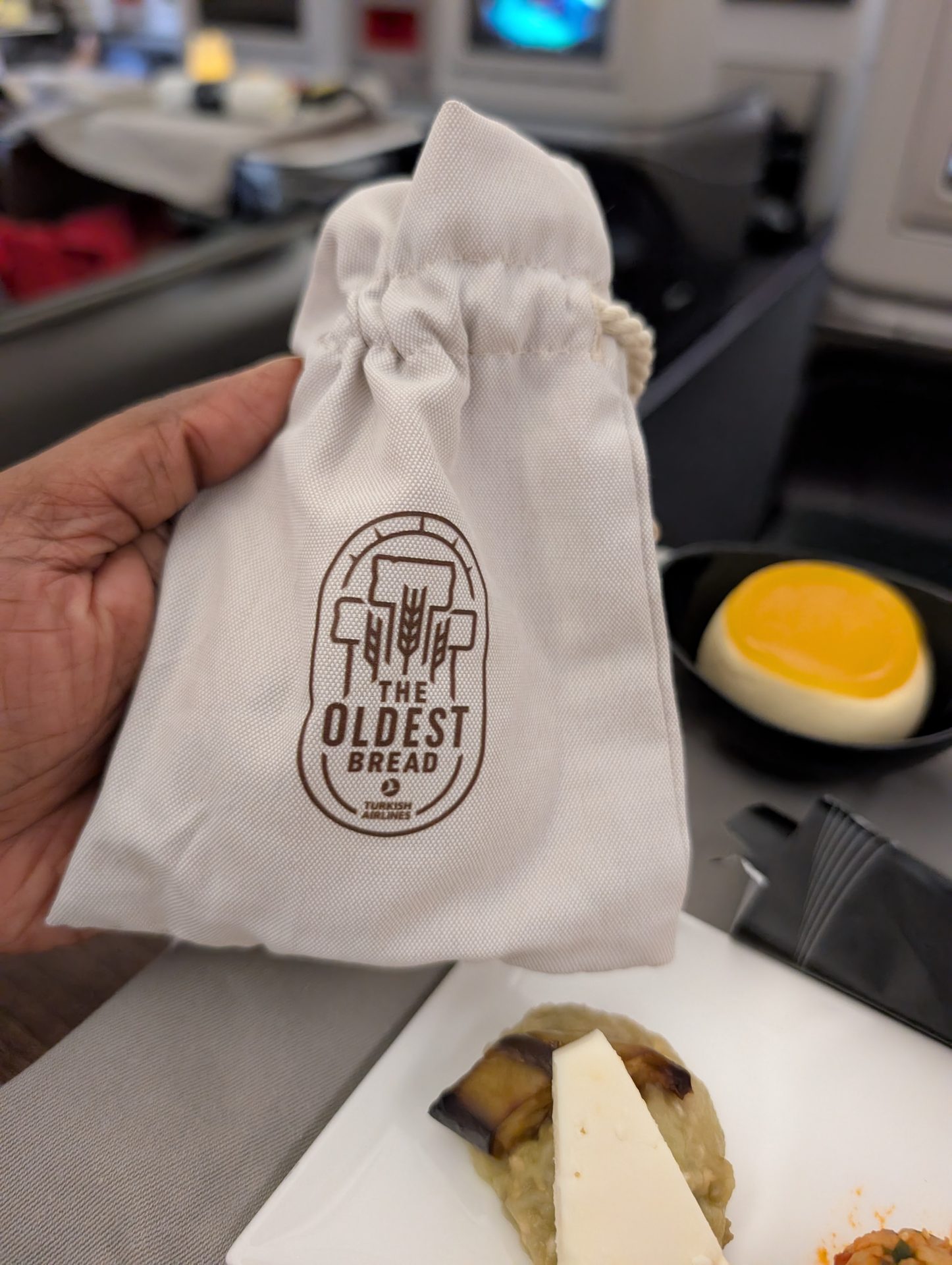 Turkish Airlines bread served in a cloth bag printed with The Oldest Bread