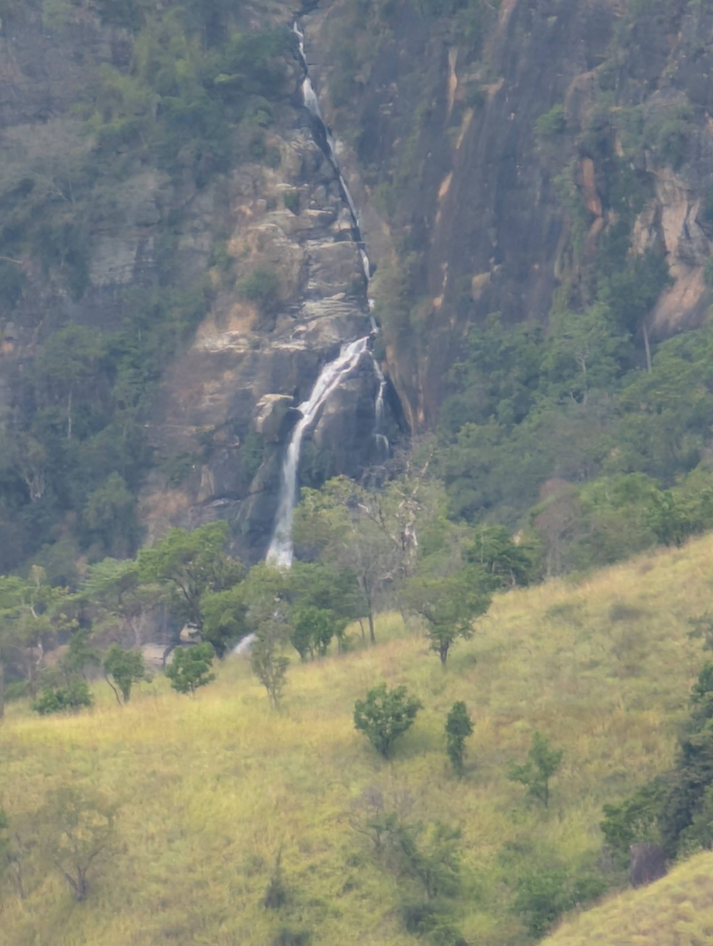 Waterfall on a cliff seen from Little Adam's Peak
